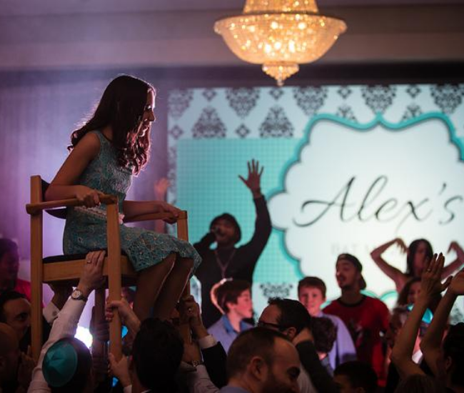 bat mitzvah girl on a chair