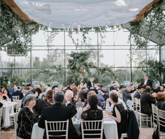 large wedding with greenery