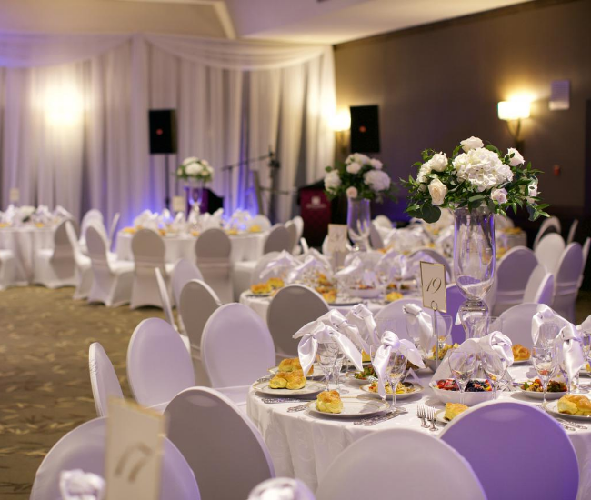 fancy wedding table with speakers in the background